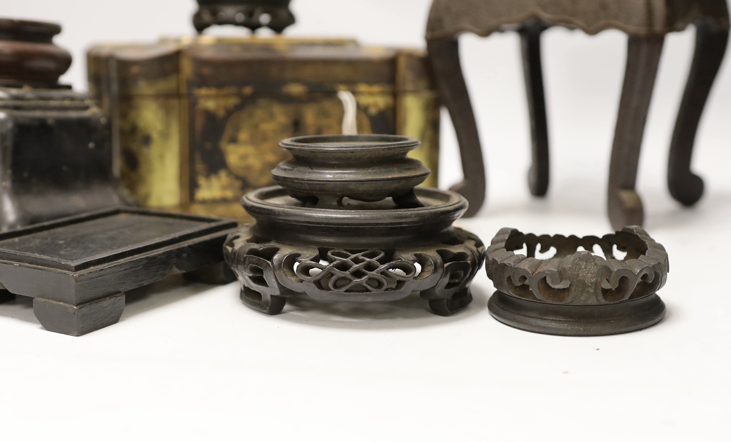 A Chinese lacquer and gilt casket together with various carved stands, largest 17cm high